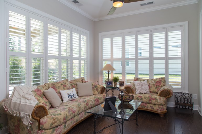 Sunroom with faux wood shutters in Las Vegas.